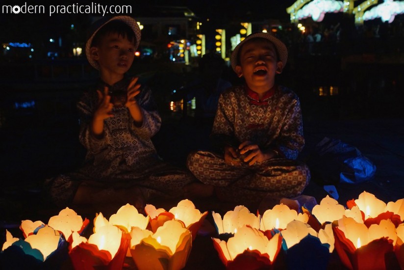 Cute little boys selling the same paper lanterns.
