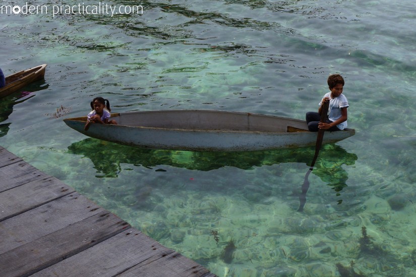 Local children ride around in these canoes asking the tourists for money for food